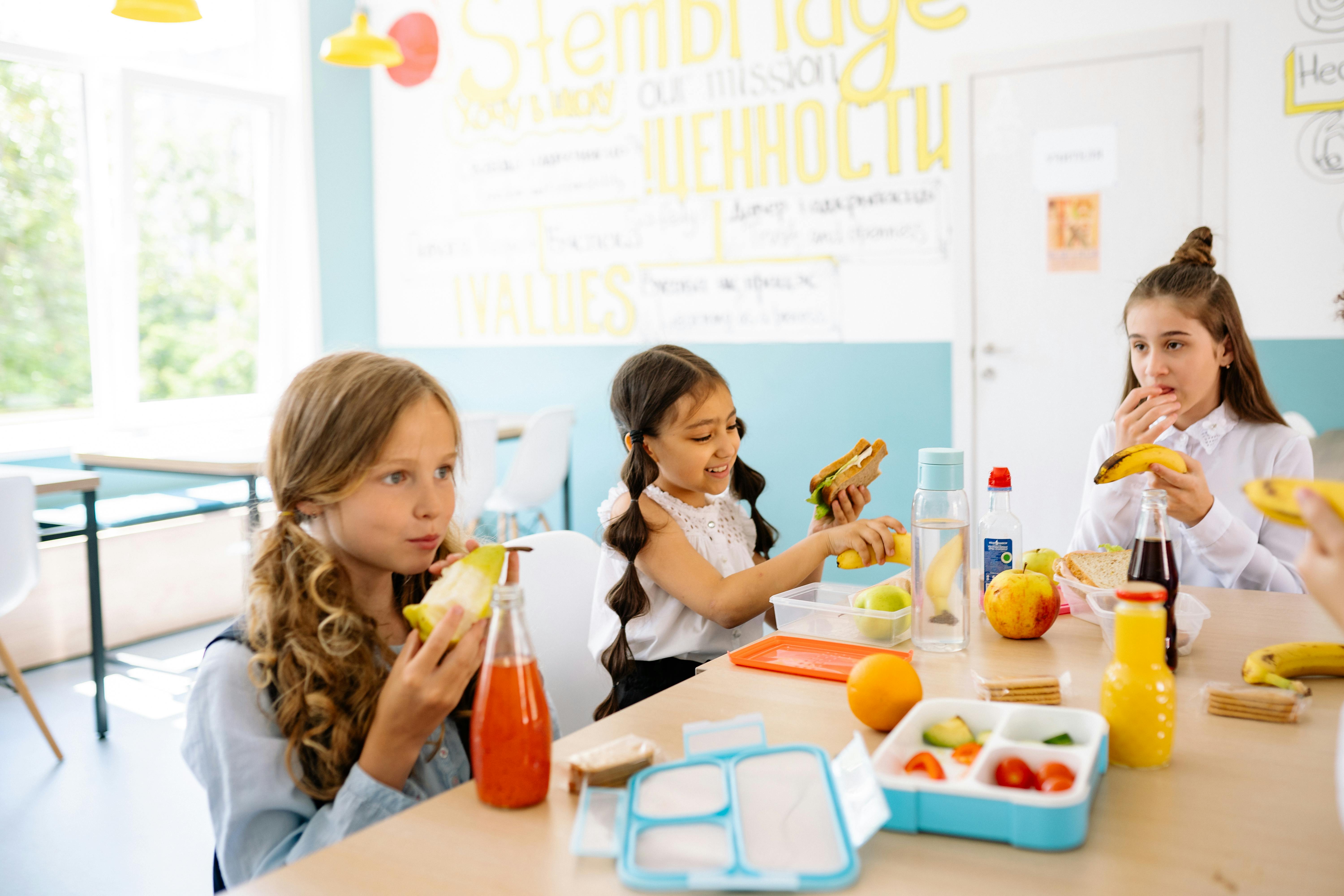 the children eating food at school